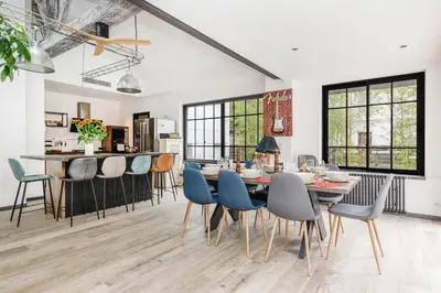 a kitchen and dining room with a table and chairs at Immogroom - Exceptional Villa Near Croisette in Cannes