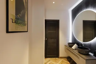 a bathroom with a mirror and a sink at Immogroom - Exceptional Villa Near Croisette in Cannes