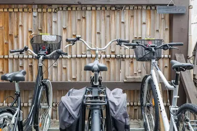 three bikes parked next to a wooden fence at Immogroom - Exceptional Villa Near Croisette in Cannes