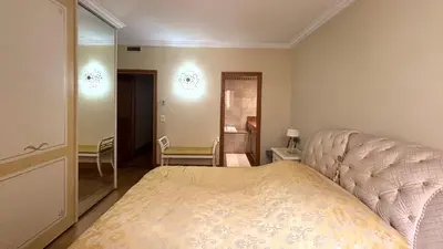 a bedroom with a bed and a mirror at PORT DE CANNES SUPERBE 3 Pièces in Cannes