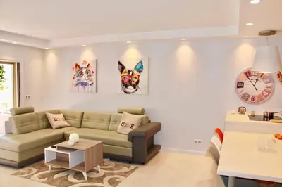 a living room with a couch and a dog on the wall at REF 2003 - Cannes Croisette - 3 mins from the Croissette in Cannes