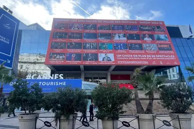 a building with a large scoreboard on the side of it at Peaceful villa with pool and garden - 5 minutes from Cannes beaches in Cannes