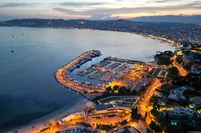 an aerial view of a marina at night at Peaceful villa with pool and garden - 5 minutes from Cannes beaches in Cannes