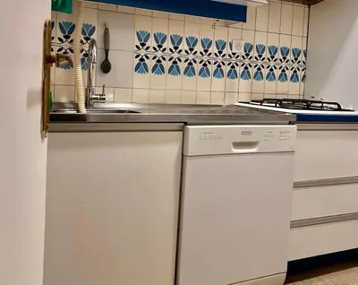 a kitchen with a sink and a dishwasher at Apartement Centre Cannes, 80m de la plage Martinez in Cannes