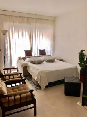 a bedroom with a large bed and a window at Apartement Centre Cannes, 80m de la plage Martinez in Cannes