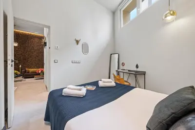 a bedroom with a bed with towels on it at Jessicannes - Architect loft near Croisette in Cannes
