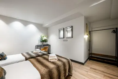 a bedroom with a bed with towels on it at Jessicannes - Architect loft near Croisette in Cannes