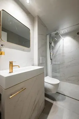 a bathroom with a sink and a toilet and a shower at Jessicannes - Architect loft near Croisette in Cannes