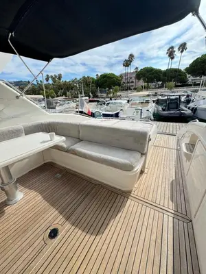 a couch sitting on the deck of a boat at yacht 17M Princess V52 Cannes port canto 3 chambres AC in Cannes