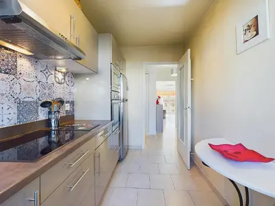 a kitchen with a sink and a counter top at Center Cannes Montfleury in Cannes