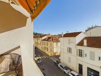 a view of a city street from a balcony at Center Cannes Montfleury in Cannes