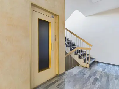 a hallway with a door and a staircase at Center Cannes Montfleury in Cannes
