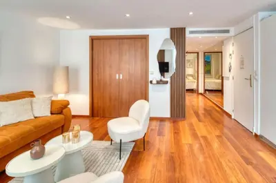 a living room with a couch and a table at Cannes 50m palais & Croisette in Cannes