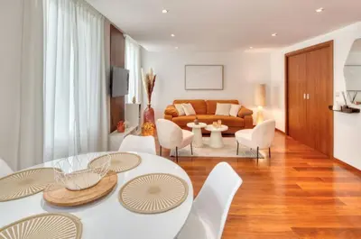 a living room with a table and chairs and a couch at Cannes 50m palais & Croisette in Cannes