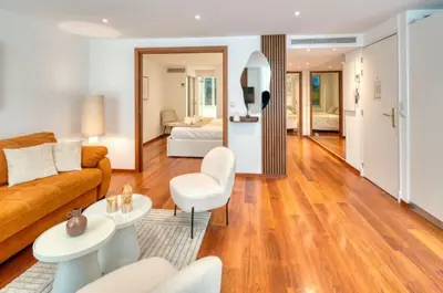 a living room with a couch and a table at Cannes 50m palais & Croisette in Cannes