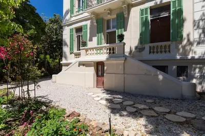 a large house with a staircase in front of it at Reine des Mers in Cannes