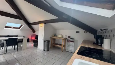 a kitchen and dining room with an attic at Reine des Mers in Cannes