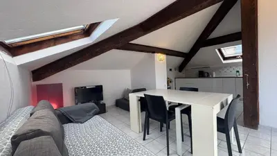 a living room with a couch and a table at Reine des Mers in Cannes