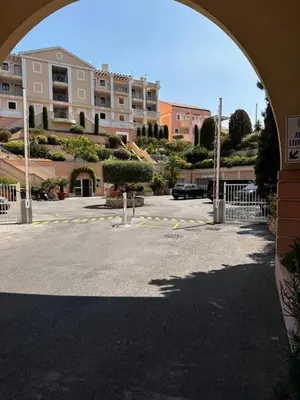 a view of a parking lot with a building at Apartment with Garden, Pool, Sea View and Parking in Cannes