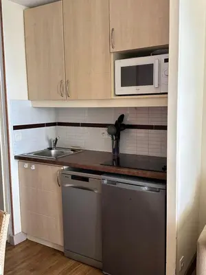 a kitchen with a sink and a microwave at RENOIR 1265 Villa Francia - F2 très belle vue mer in Cannes