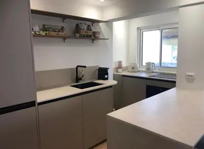 a kitchen with a sink and a counter top at Studio terrasse Croisette in Cannes