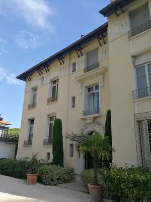 a building with a palm tree in front of it at CANNES Vue Mer & Balcon dans Villa Exceptionnelle Belle Époque la Californie in Cannes