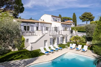 an exterior view of a villa with a swimming pool at One of a kind 6 BR 6 bath villa sauna jacuzzi pool just 15 mns off town in Cannes