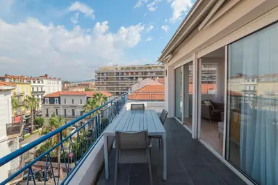 a balcony with a blue table and chairs on it at REF 1493 - Cannes -City Center Banane District in Cannes