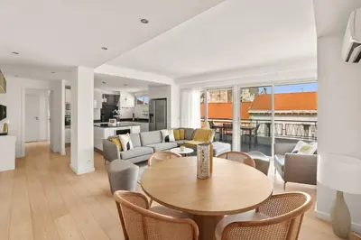 a living room with a table and a couch at REF 1493 - Cannes -City Center Banane District in Cannes
