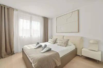 a bedroom with a bed with two shoes on it at REF 1493 - Cannes -City Center Banane District in Cannes