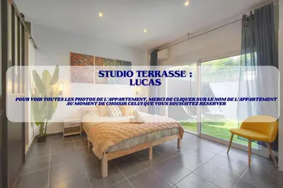 a bedroom with a bed and a large window at VCA House -5 appartements - 15Min Mer- Wifi-Clim in Cannes