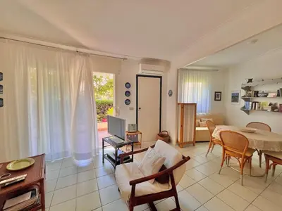 a living room with a table and a dining room at Two rooms near Martinez in Cannes