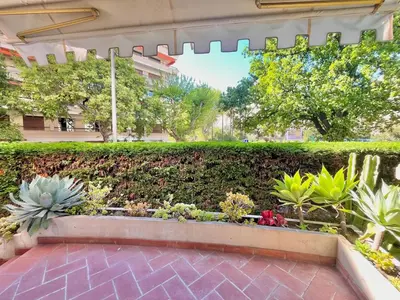 a garden in the middle of a building at Two rooms near Martinez in Cannes