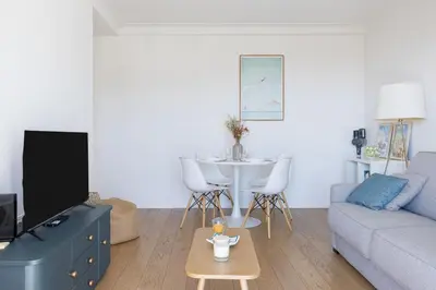 a living room with a couch and a table at Perchoir - Balcon, vue sur la ville, Palais&Plages in Cannes