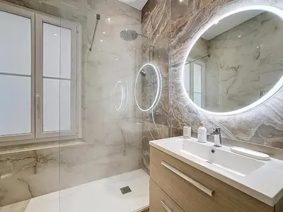 a bathroom with a sink and a mirror at Effet Mer - neuf, central, Port, Plage&Palais, clim in Cannes