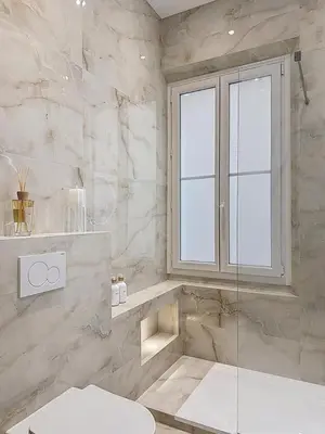 a bathroom with a toilet and a window and a shower at Effet Mer - neuf, central, Port, Plage&Palais, clim in Cannes