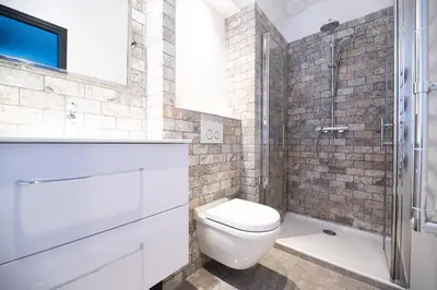 a bathroom with a toilet and a shower at Croisette Cosy Studio in Cannes