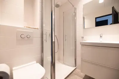a bathroom with a shower and a toilet and a sink at Seaview Studio, Palais des Festivals in Cannes