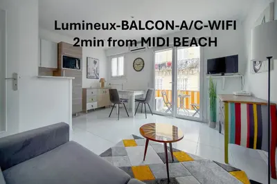 a living room with a couch and a table at Studio lumineux avec balcon A0B207 in Cannes