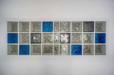 a white shelf with blue glass squares on it at Studio lumineux avec balcon A0B207 in Cannes