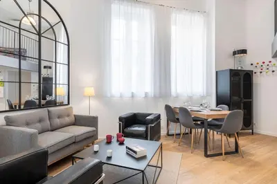 a living room with a couch and a table at Cosy T2 in Cannes in Cannes