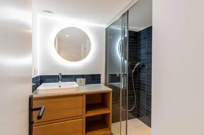 a bathroom with a sink and a shower at Cosy T2 in Cannes in Cannes