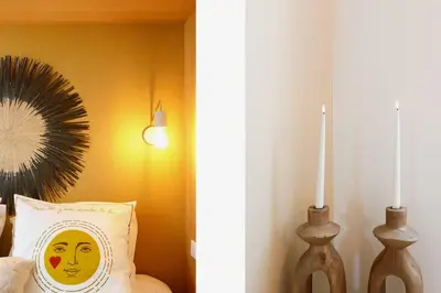 a bedroom with a pillow with a face on it at Modern 2 Bedroom Overlooking Cannes Old Port in Cannes