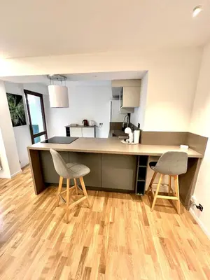 a kitchen with two chairs and a counter top at Studio La Baronne in Cannes