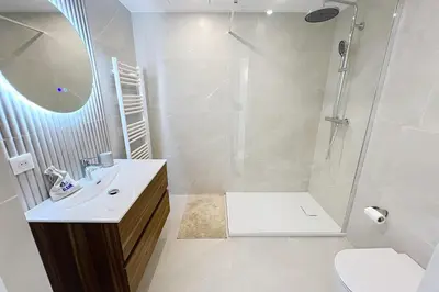 a bathroom with a shower and a sink and a toilet at Wide and sunny 3 BR 2 Baths heart of Cannes gorgeous terrace city ctr in Cannes
