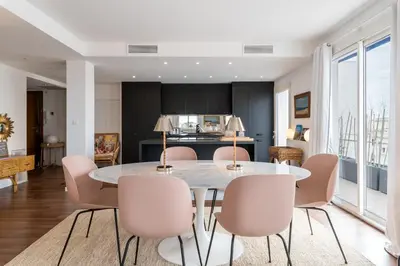 a dining room with a table and chairs at Geoffrey By Terrys Homes in Cannes