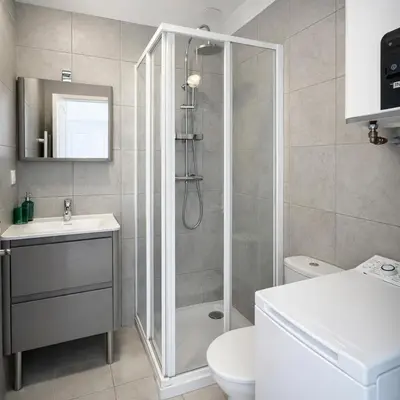 a bathroom with a shower and a toilet and a sink at Cannes Central Balcony- 9 min Festival in Cannes
