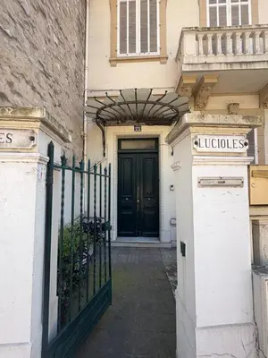a entrance to a house with a black door at Cannes Central Balcony- 9 min Festival in Cannes