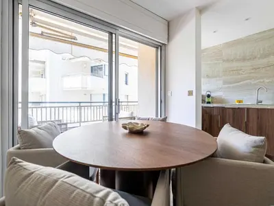 a dining room with a wooden table and chairs at Elegant apartment - AC-4P - Cannes in Cannes
