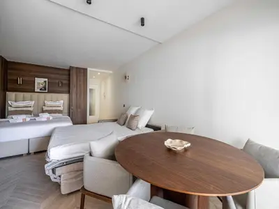 a bedroom with a bed and a table in a room at Elegant apartment - AC-4P - Cannes in Cannes